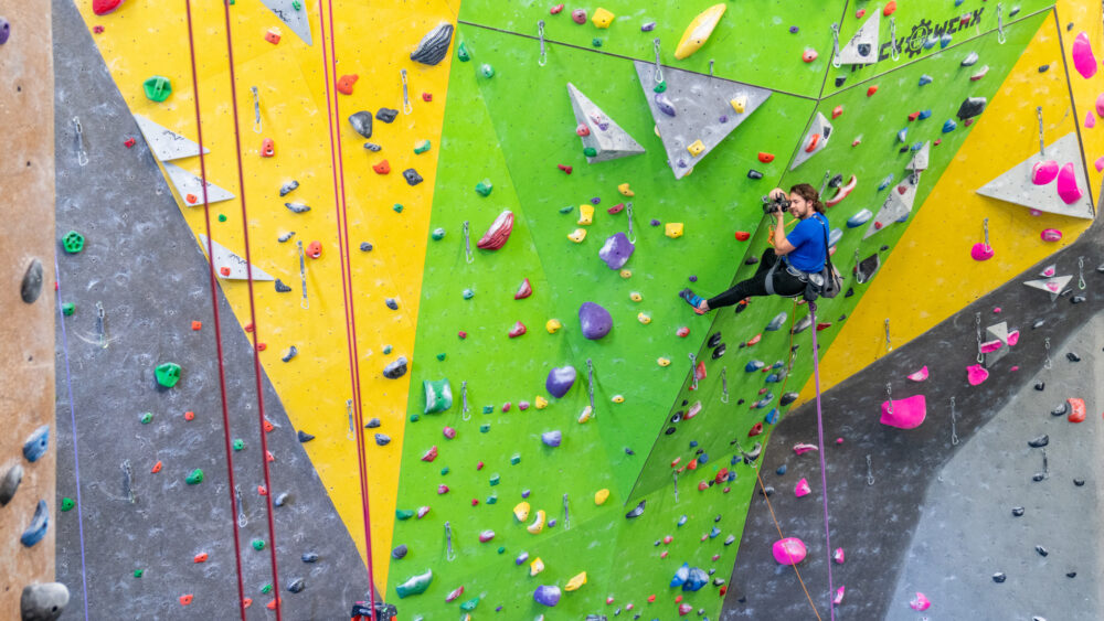 Caleb shooting photos while climbing